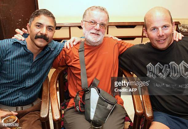 Britons Leo Dickinson and Ralph Mitchell are joined by Indian R.C. Tripathi as they pose during a press conference in Kathmandu on September 22 after...