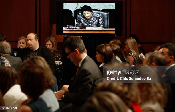 Senate Finance Committee member Sen. Olympia Snowe appears on a television during a mark up session on the health care reform legislation on Capitol...