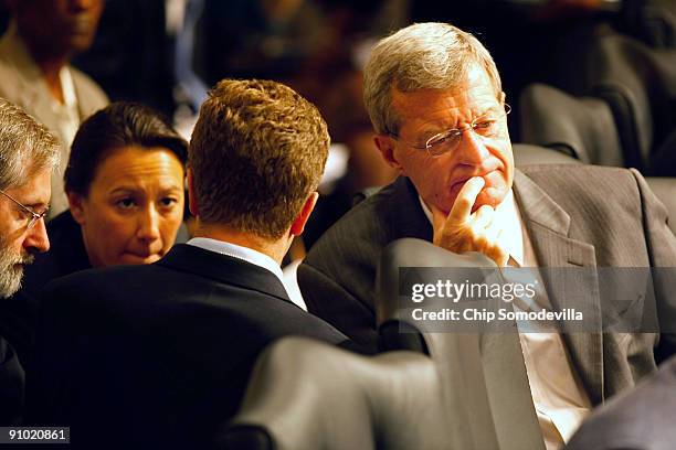 Senate Finance Committee Chairman Max Baucus talks with committee staff members while presiding over a mark up session on the health care reform...