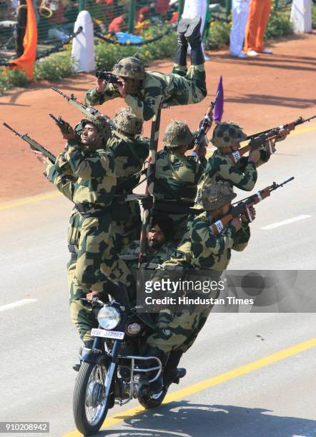 Indian soldiers display their skills on motorcycles during the full dress rehearsal for the Republic Day Parade-2008, in New Delhi.