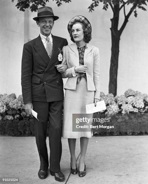 Fred Astaire , famed dancer, singer and actor, with wife Phyllis at Belmont Park, NY 1951.