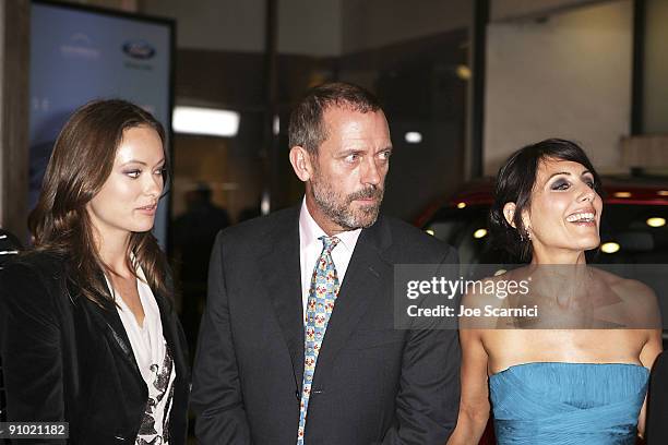 Actress Olivia Wilde, Actor Hugh Laurie, and Actress Lisa Edelstein arrive at the "House" Season 6 premiere screening event at the ArcLight Cinemas...