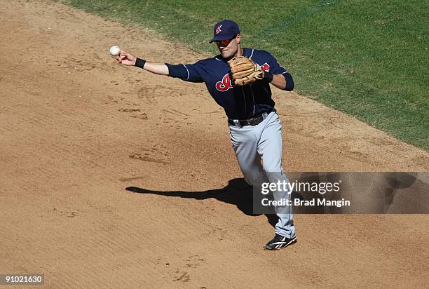 Jamey Carroll of the Cleveland Indians throws to first base against the Oakland Athletics during the game at the Oakland-Alameda County Coliseum on...