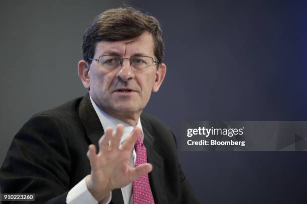 Vittorio Colao, chief executive officer of Vodafone Group Plc, gestures while speaking during a panel session on day three of the World Economic...