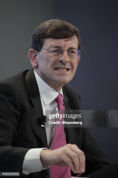 Vittorio Colao, chief executive officer of Vodafone Group Plc, gestures while speaking during a panel session on day three of the World Economic...