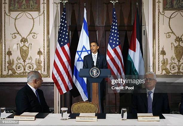 President Barack Obama speaks while Israeli Prime Minister Benjamin Netanyahu and Palestinian President Mahmoud Abbas during a trilateral meeting at...