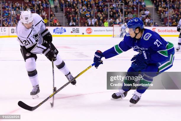 Vancouver Canucks Defenceman Ben Hutton blocks a shot by Los Angeles Kings Center Nick Shore during their NHL game at Rogers Arena on January 23,...