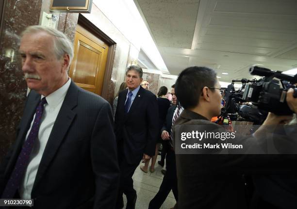 Sen. Angus King, , , and Sen. Joe Manchin , walk out of a bipartisan meeting on immigration, at Sen. Susan Collins office on Capitol Hill January 25,...
