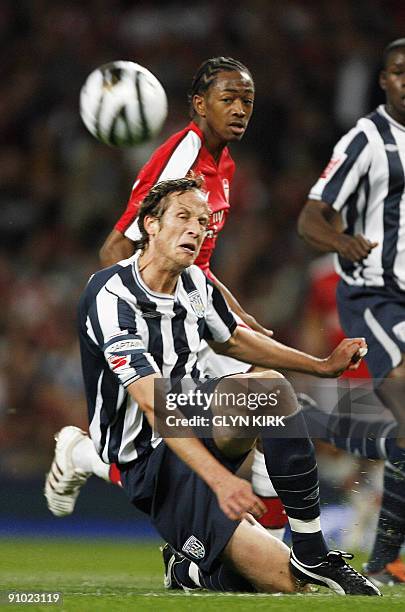 West Bromwich Albion's Swedish defender Jonas Olsson vies with Arsenal's Sanchez Watt during their Carling Cup third round match against Arsenal at...