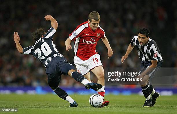 Arsenal's English midfielder Jack Wilshere goes past West Bromwich Albion's Portuguese midfielder Andrade Filipe Teixeira and Chilean defender...