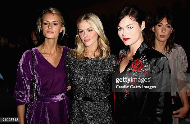 Jaquetta Wheeler, Donna Air and Jasmine Guiness watch from the front row at the Burberry Prorsum Spring/Summer 2010 Show at Rootstein Hopkins Parade...