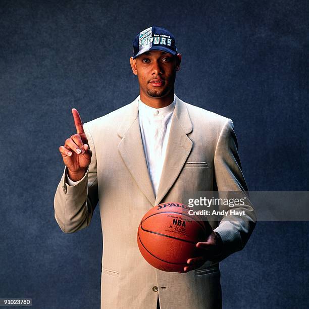 Tim Duncan poses for a photo after being selected by the San Antonio Spurs at the 1997 NBA Draft in New York, New York. NOTE TO USER: User expressly...