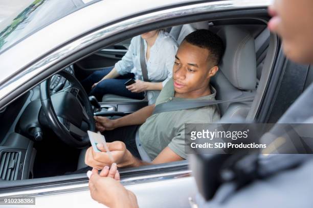 man gets pulled over for speeding - black police stock pictures, royalty-free photos & images
