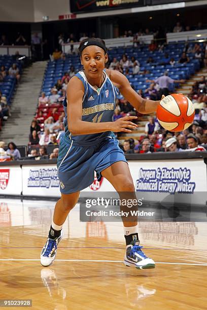 Candice Wiggins of the Minnesota Lynx moves the ball up court during the game against the Sacramento Monarchs at Arco Arena on September 13, 2009 in...