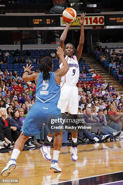 Hamchetou Maïga-Ba of the Sacramento Monarchs shoots a jump shot over Roneeka Hodges of the Minnesota Lynx during the game at Arco Arena on September...