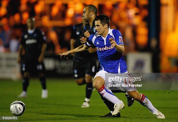 Paul Thirlwell of Carlisle is beaten to the ball by Anthony Vanden Borre of Portsmouth during the Carling Cup third round game between Carlisle...