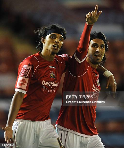 Hugo Colace of Barnsley celebrates with Anderson De Silva after scoring the third goal during the Carling Cup Third Round game between Barnsley and...