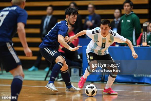 Maximiliano Rescia of Argentina and Manabu Takita of Japan compete for the ball during the Futsal international friendly match between Japan and...