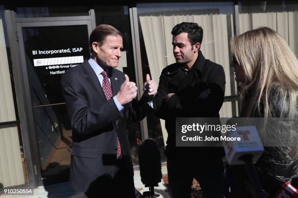 Sen. Richard Blumenthal , speaks to Guatemalan immigrant Joel Colindres and his American wife Samantha after Colindres' ICE check-in on January 25,...