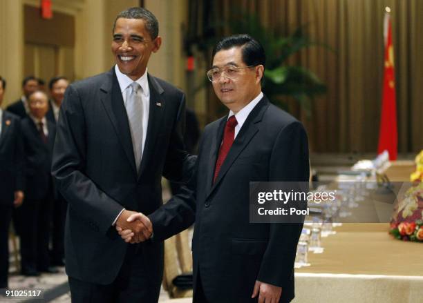 President Barack Obama shakes hands with President Hu Jintao of China at a bilateral meeting at the Waldorf Astoria Hotel on September 22, 2009 in...