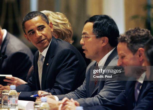 President Barack Obama listens to President Hu Jintao of China speak at a bilateral meeting at the Waldorf Astoria Hotel on September 22, 2009 in New...