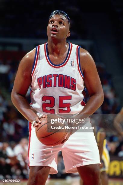 Oliver Miller of the Detroit Pistons shoots a foul shot during a game played on November 27, 1994 at the Palace of Auburn Hills in Auburn Hills,...