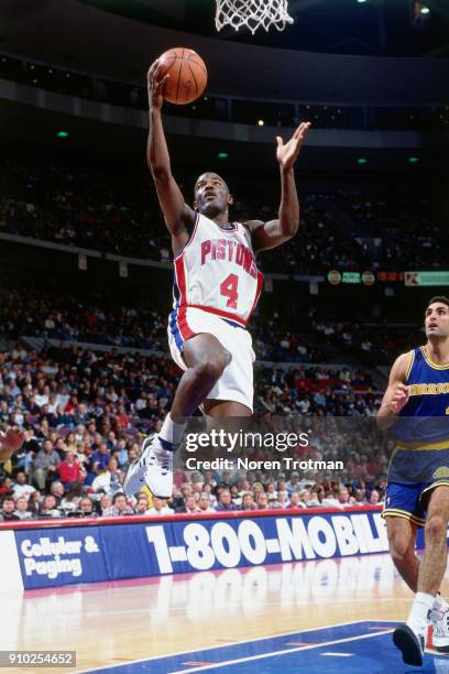 Joe Dumars of the Detroit Pistons shoots during a game played on November 27, 1994 at the Palace of Auburn Hills in Auburn Hills, Michigan. NOTE TO...