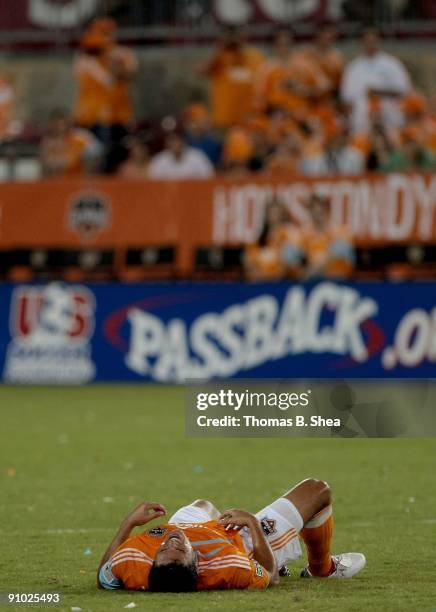 Luis Angel Landin of the Houston Dynamo lays injured on the pitch against Real Salt Lake at Robertson Stadium on September 19, 2009 in Houston, Texas.