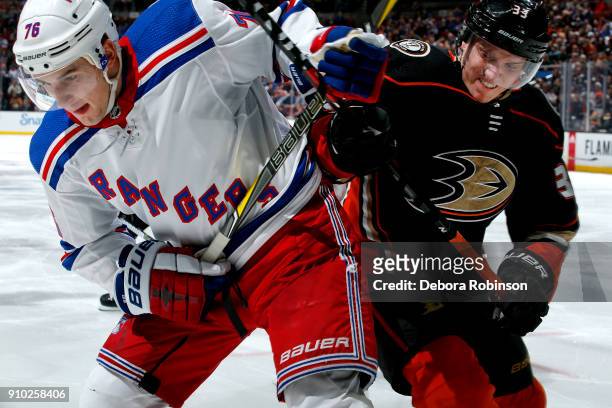 Brady Skjei of the New York Rangers battles for position against Jakob Silfverberg of the Anaheim Ducks during the game on January 23, 2018 at Honda...