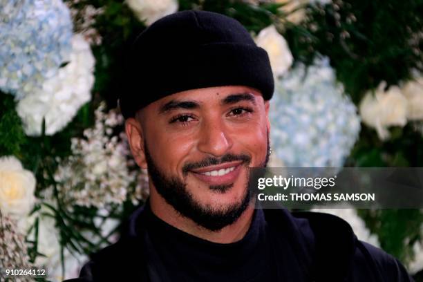 French singer Slimane poses upon arriving to the Diner de la Mode fundraiser dinner, to benefit the French anti-AIDS association Sidaction, on...