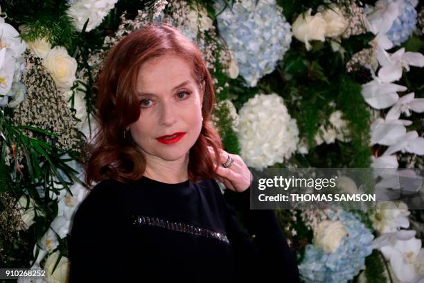 French actress Isabelle Huppert poses upon arriving to the Diner de la Mode fundraiser dinner, to benefit the French anti-AIDS association Sidaction,...