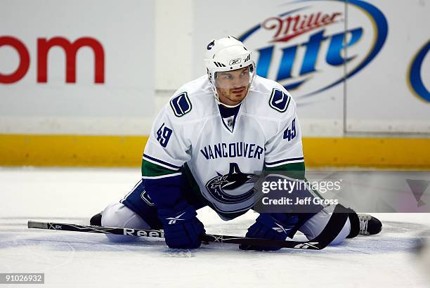 Alexandre Bolduc of the Vancouver Canucks stretches prior to the preseason game against the Anaheim Ducks at the Honda Center on September 17, 2009...