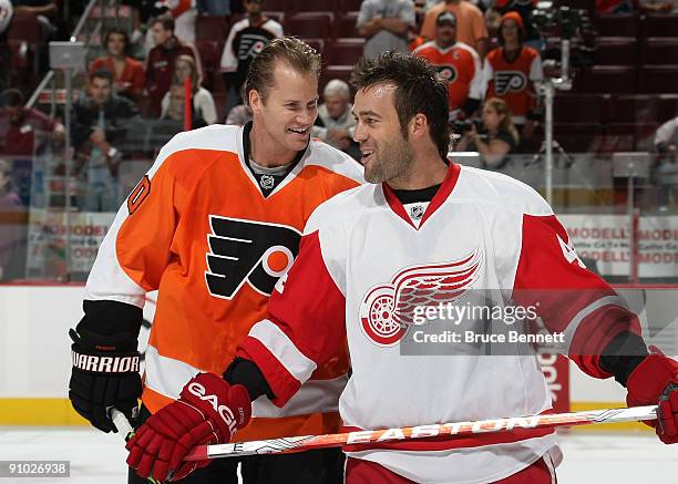 Chris Pronger of the Philadelphia Flyers and Todd Bertuzzi of the Detroit Red Wings skate in warmups prior to preseason action at the Wachovia Center...