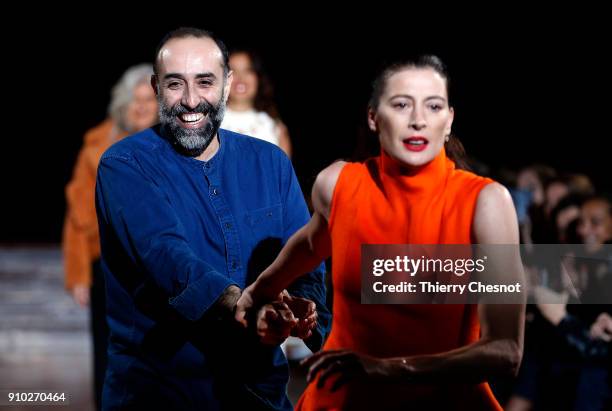 Lebanese designer Rabih Kayrouz and French dancer and choreographer Marie-Agnes Gillot acknowledge the audience at the end of the Maison Rabih...