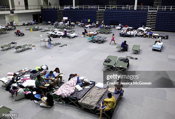 Flood victims rest on cots in the Cobb Civic Center September 22, 2009 in Marietta, Georgia. Flooding due to rain forced people out of their homes...