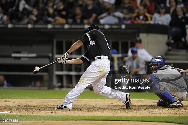 Carlos Quentin of the Chicago White Sox hits a grand slam home run in the fifth inning against the Kansas City Royals on September 19, 2009 at U.S....