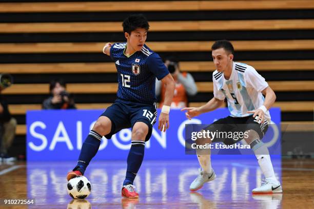 Kazuya Shimizu of Japan and Maximiliano Rescia of Argentina compete for the ball during the Futsal international friendly match between Japan and...