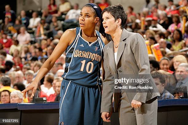 Lindsey Harding and head coach Julie Plank of the Washington Mystics talk near the side line in Game Two of the Eastern Conference Semifinals during...