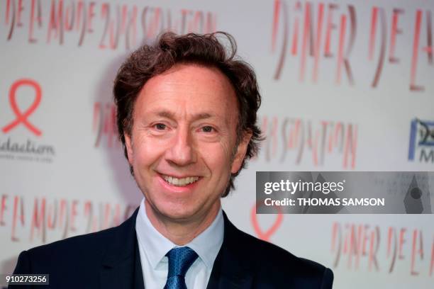 French television presenter Stephane Bern poses upon arriving to the Diner de la Mode fundraiser dinner, to benefit the French anti-AIDS association...