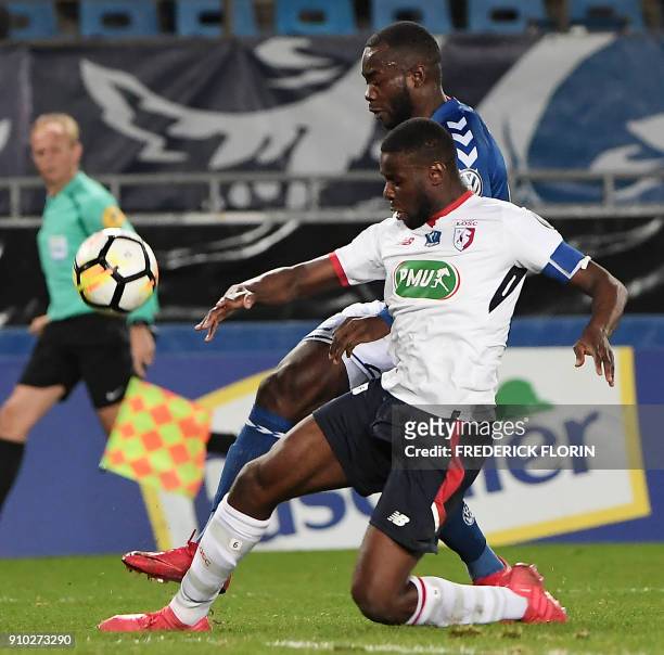 Strasbourg's French forward Stephane Bahoken vies with Lille's Cameroon midfielder Ibrahim Amadou during the French Cup football match between...