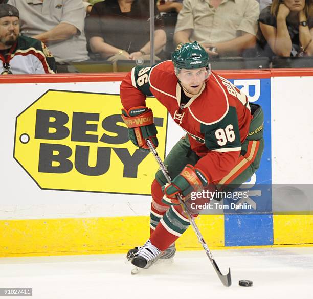 Pierre-Marc Bouchard of the Minnesota Wild secures the puck during the third period of a preseason game against the Columbus Blue Jackets on...