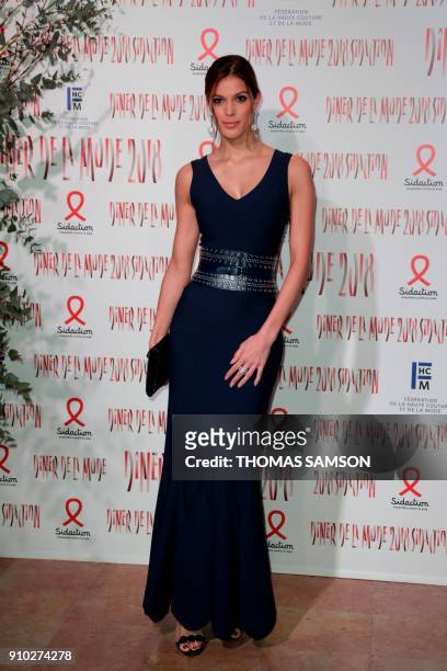 Miss Universe 2016 Iris Mitternaere poses upon arriving to the Diner de la Mode fundraiser dinner, to benefit the French anti-AIDS association...