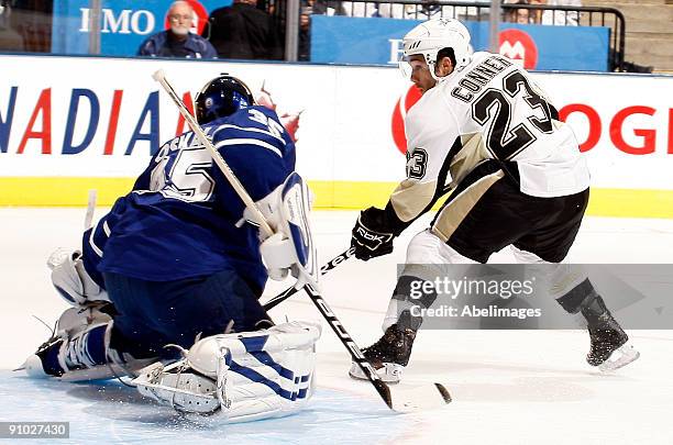Chris Conner of the Pittsburgh Penguins scores on goalie Vesa Toskala of the Toronto Maple Leafs during a pre-season NHL game at the Air Canada...