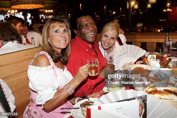 Singer Ireen Sheer and singer Roberto Blanco and his girlfriend Luzandra Strassburg attend the GoldstarTV wiesn 2009 at Weinzelt at the...