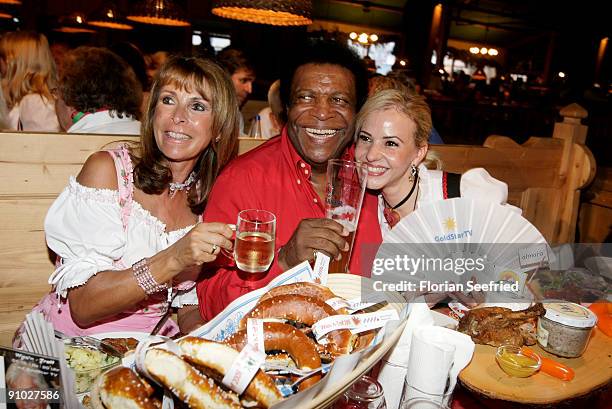 Singer Ireen Sheer and singer Roberto Blanco and his girlfriend Luzandra Strassburg attend the GoldstarTV wiesn 2009 at Weinzelt at the...