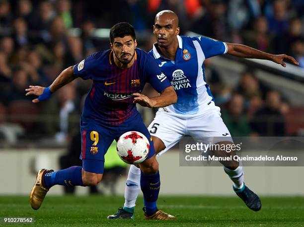 Luis Suarez of Barcelona competes for the ball with Edinaldo Gomes Pereira of Espanyol during the Spanish Copa del Rey Quarter Final Second Leg match...