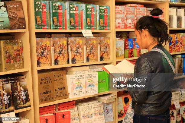 Literature Lovers reading book during the Jaipur Literature Festival 2018 at Diggi Palace in Jaipur, Rajasthan, India on 25 Jan,2018.