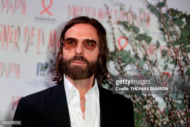 French hair stylist John Nollet poses upon arriving to the Diner de la Mode fundraiser dinner, to benefit the French anti-AIDS association Sidaction,...