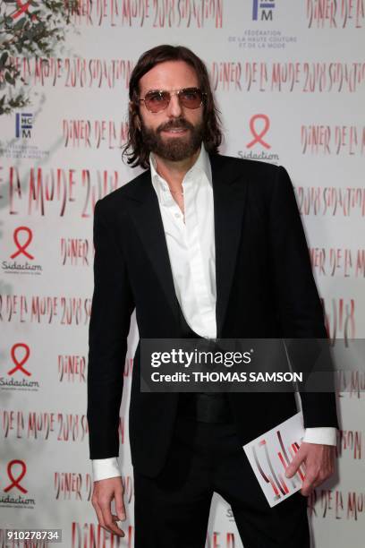 French hair stylist John Nollet poses upon arriving to the Diner de la Mode fundraiser dinner, to benefit the French anti-AIDS association Sidaction,...