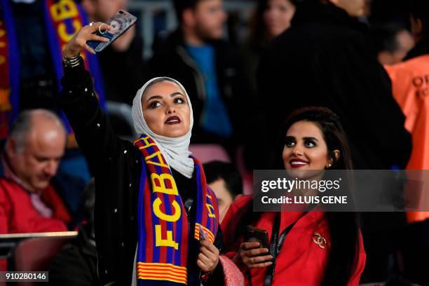 Barcelona supporters pose for a selfie during the Spanish 'Copa del Rey' quarter-final second leg football match between FC Barcelona and RCD...